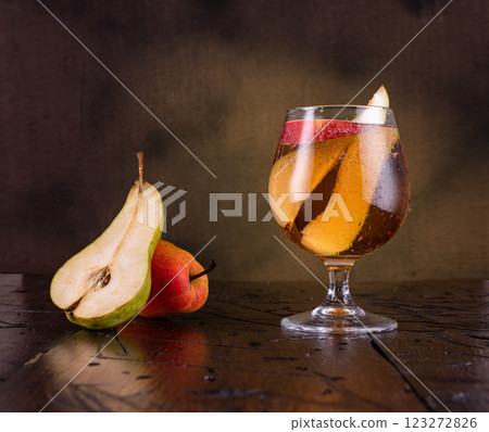 Fruit drink in a glass. Sweet drink in a glass. Still life with fruit on a drink. Fruit drink in a glass. Sweet drink in a glass. Still life with fruit on a drink. 123272826