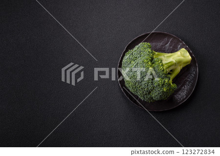 A sprig of raw green broccoli as an ingredient for a healthy meal A sprig of raw green broccoli as an ingredient for a healthy meal 123272834