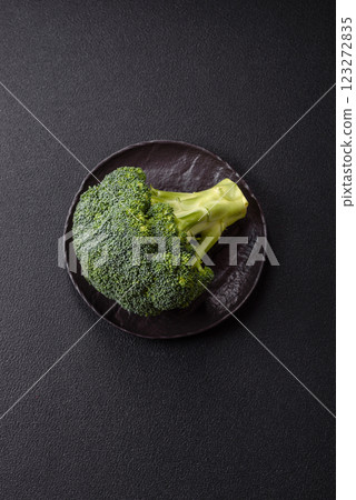 A sprig of raw green broccoli as an ingredient for a healthy meal A sprig of raw green broccoli as an ingredient for a healthy meal 123272835
