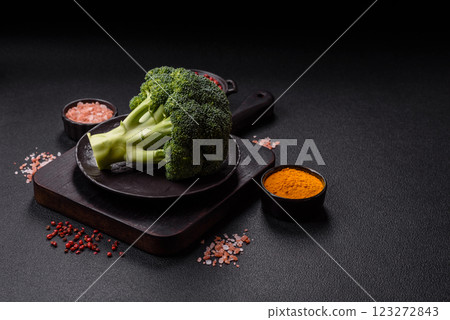A sprig of raw green broccoli as an ingredient for a healthy meal 123272843