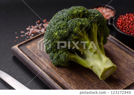 A sprig of raw green broccoli as an ingredient for a healthy meal 123272849