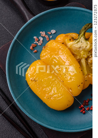 Yellow sweet pepper cut in half and grilled with salt, spices and herbs Yellow sweet pepper cut in half and grilled with salt, spices and herbs 123272875