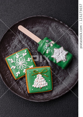 Natural popsicle ice cream on a stick in the style and colors of Christmas 123273037