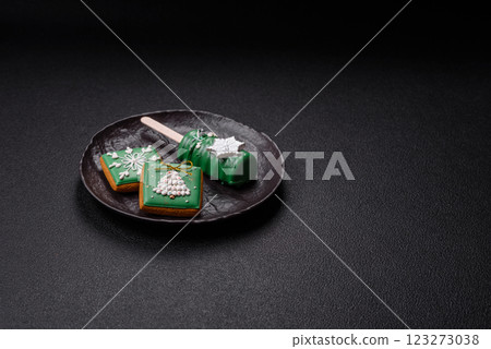 Natural popsicle ice cream on a stick in the style and colors of Christmas 123273038