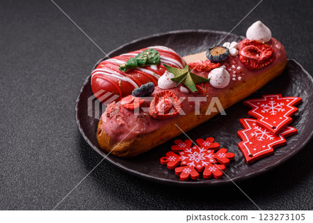 Sweet eclair with chocolate filling, decorated for Christmas 123273105