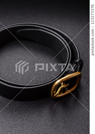 New leather women's belt with an old-style metal buckle New leather women's belt with an old-style metal buckle 123273376