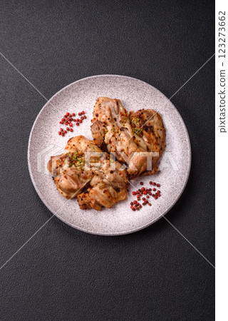 Grilled boneless chicken thigh with salt, spices and herbs 123273662