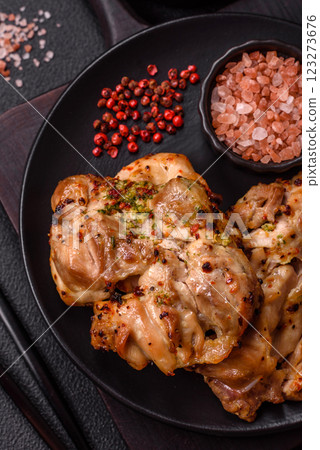 Grilled boneless chicken thigh with salt, spices and herbs 123273676