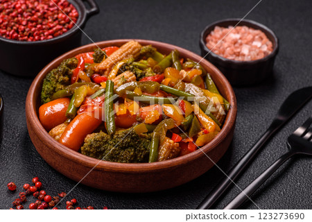 Mix of vegetables corn, carrots, peppers, broccoli, onions in teriyaki sauce 123273690