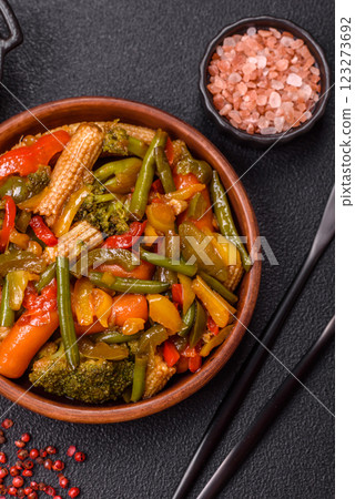 Mix of vegetables corn, carrots, peppers, broccoli, onions in teriyaki sauce 123273692