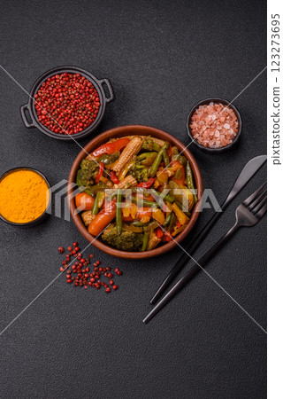 Mix of vegetables corn, carrots, peppers, broccoli, onions in teriyaki sauce 123273695