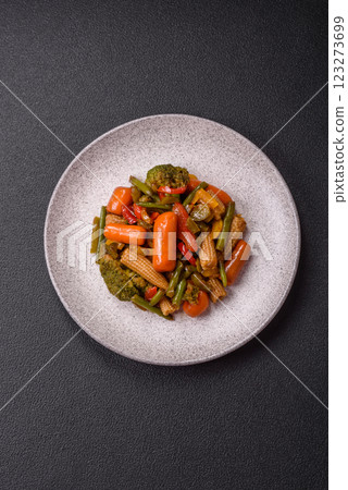 Mix of vegetables corn, carrots, peppers, broccoli, onions in teriyaki sauce 123273699