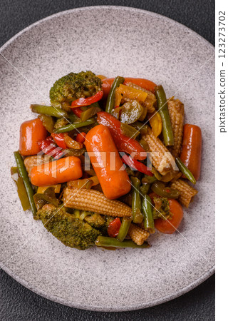 Mix of vegetables corn, carrots, peppers, broccoli, onions in teriyaki sauce 123273702