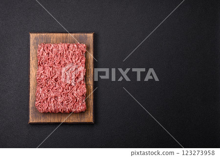 Fresh raw ground minced beef with salt and spices 123273958