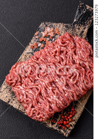 Fresh raw ground minced beef with salt and spices 123273979