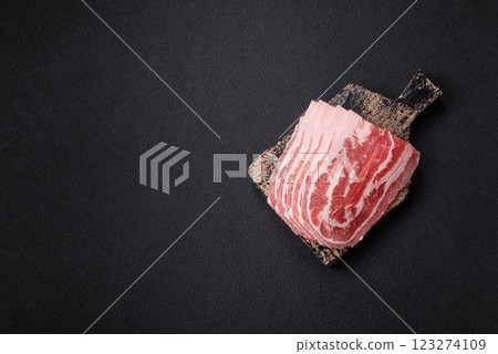 Fresh raw bacon sliced with spices and herbs Fresh raw bacon sliced with spices and herbs 123274109