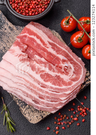 Fresh raw bacon sliced with spices and herbs 123274114