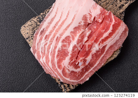 Fresh raw bacon sliced with spices and herbs Fresh raw bacon sliced with spices and herbs 123274119