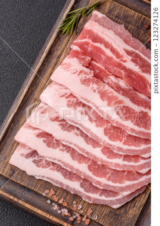 Fresh raw bacon sliced with spices and herbs 123274126
