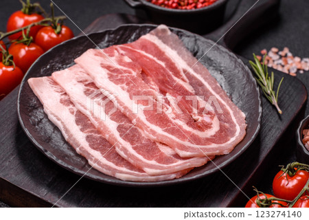 Fresh raw bacon sliced with spices and herbs 123274140