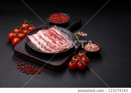 Fresh raw bacon sliced with spices and herbs Fresh raw bacon sliced with spices and herbs 123274143