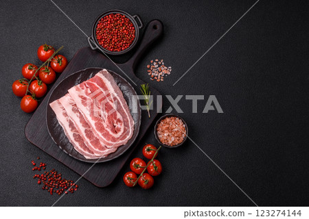 Fresh raw bacon sliced with spices and herbs Fresh raw bacon sliced with spices and herbs 123274144