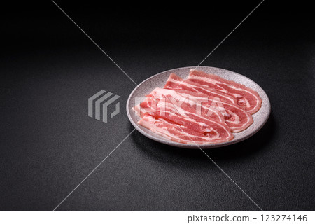 Fresh raw bacon sliced with spices and herbs 123274146