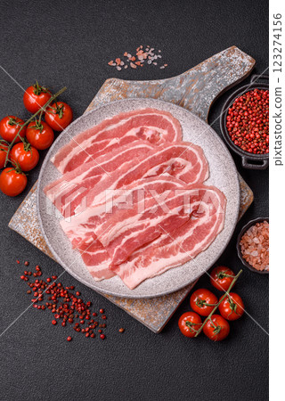 Fresh raw bacon sliced with spices and herbs 123274156
