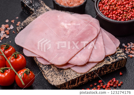 Ham cut into square slices for making delicious nutritious sandwiches Ham cut into square slices for making delicious nutritious sandwiches 123274176