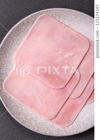 Ham cut into square slices for making delicious nutritious sandwiches Ham cut into square slices for making delicious nutritious sandwiches 123274187