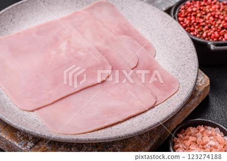 Ham cut into square slices for making delicious nutritious sandwiches Ham cut into square slices for making delicious nutritious sandwiches 123274188