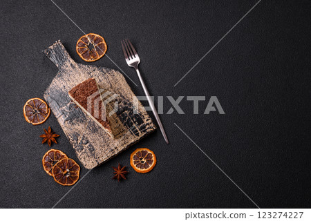 Slice of sweet cheesecake sprinkled with chopped chocolate 123274227