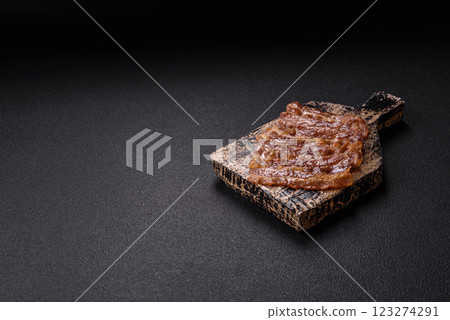 Crispy fried pork bacon sliced with salt, spices and herbs Crispy fried pork bacon sliced with salt, spices and herbs 123274291