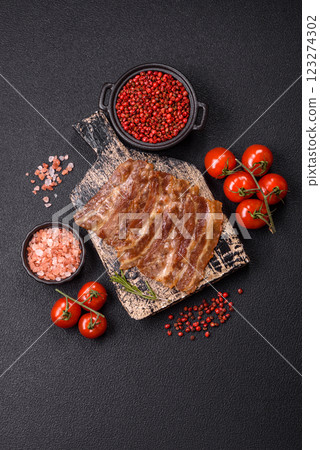 Crispy fried pork bacon sliced with salt, spices and herbs Crispy fried pork bacon sliced with salt, spices and herbs 123274302