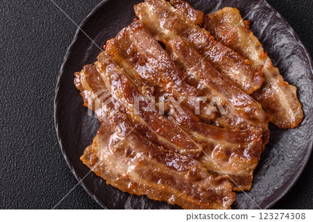 Crispy fried pork bacon sliced with salt, spices and herbs 123274308