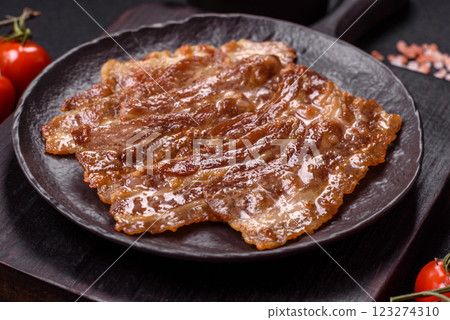 Crispy fried pork bacon sliced with salt, spices and herbs 123274310