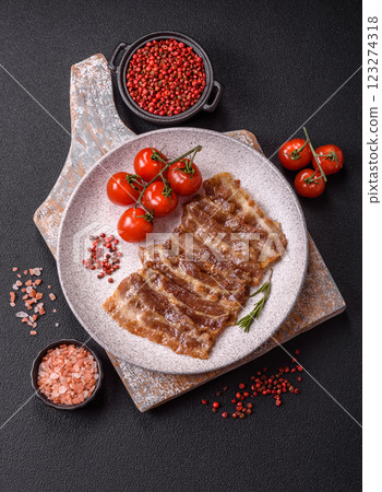 Crispy fried pork bacon sliced with salt, spices and herbs 123274318