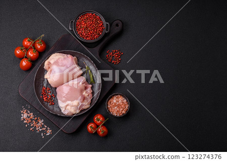 Fresh raw chicken thigh fillets with salt, spices and herbs 123274376
