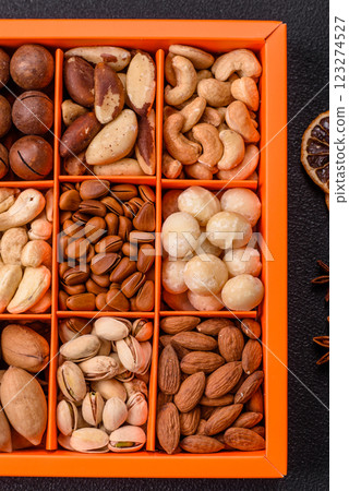 Box with various nuts cashew, macadamia, peanut, cedar, pecan, walnut, brazil, hazelnut 123274527