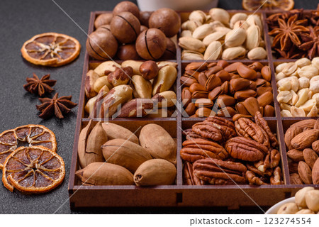 Box with various nuts cashew, macadamia, peanut, cedar, pecan, walnut, brazil, hazelnut 123274554