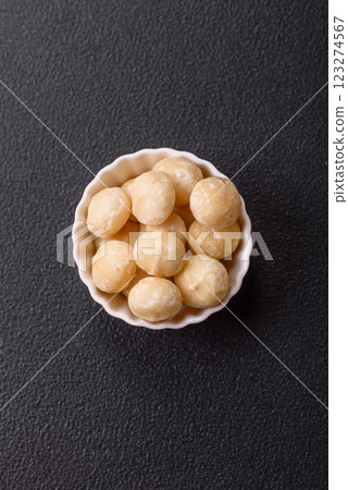 Delicious nutritious macadamia nuts in ceramic bowl 123274567