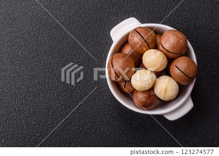 Delicious nutritious macadamia nuts in ceramic bowl Delicious nutritious macadamia nuts in ceramic bowl 123274577