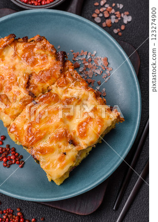 Lasagna or pasta layered with meat, cheese, salt, spices and herbs Lasagna or pasta layered with meat, cheese, salt, spices and herbs 123274900