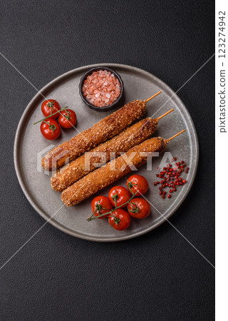 Lula kebab meat fried on a fire in breading with salt, spices and herbs Lula kebab meat fried on a fire in breading with salt, spices and herbs 123274942