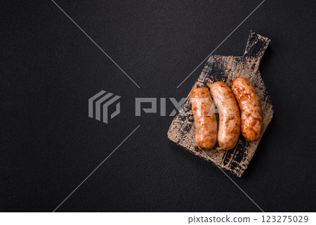 Grilled sausages with spices and herbs Grilled sausages with spices and herbs 123275029
