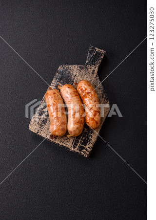 Grilled sausages with spices and herbs 123275030