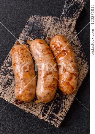 Grilled sausages with spices and herbs Grilled sausages with spices and herbs 123275033