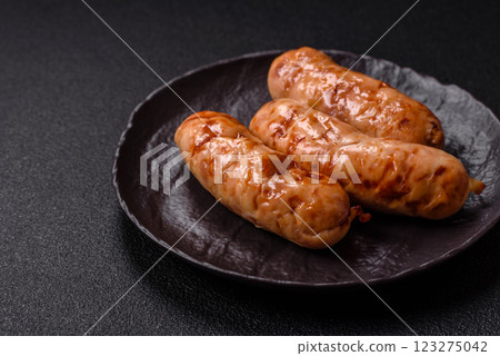 Grilled sausages with spices and herbs Grilled sausages with spices and herbs 123275042