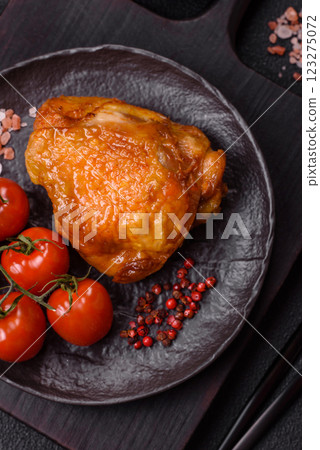 Delicious juicy chicken thighs baked with salt, spices and herbs 123275072