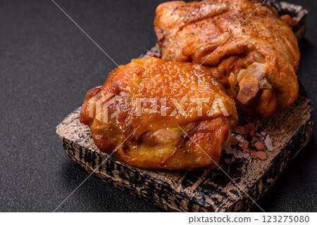 Delicious juicy chicken thighs baked with salt, spices and herbs 123275080